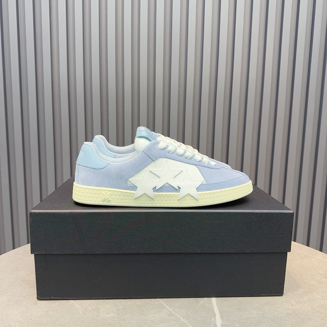 AMIRI Light Blue Low-Top Sneakers with White Stars and Cream Sole