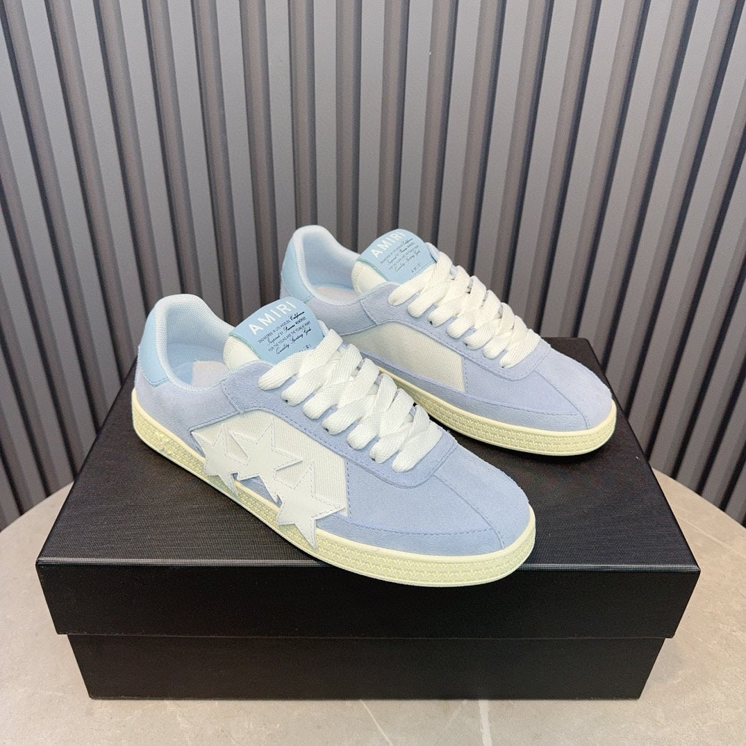 AMIRI Light Blue Low-Top Sneakers with White Stars and Cream Sole