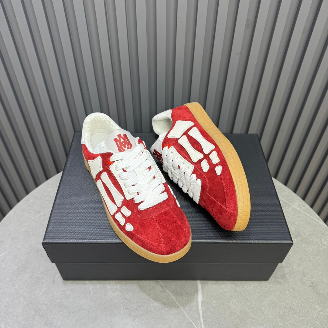 AMIRI Red Low-Top Sneakers with White Bone Details and Gum Sole