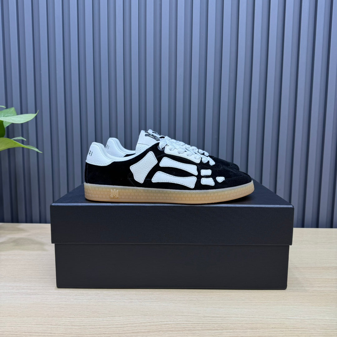 AMIRI Black Low-Top Sneakers with White Bone Details and Gum Sole
