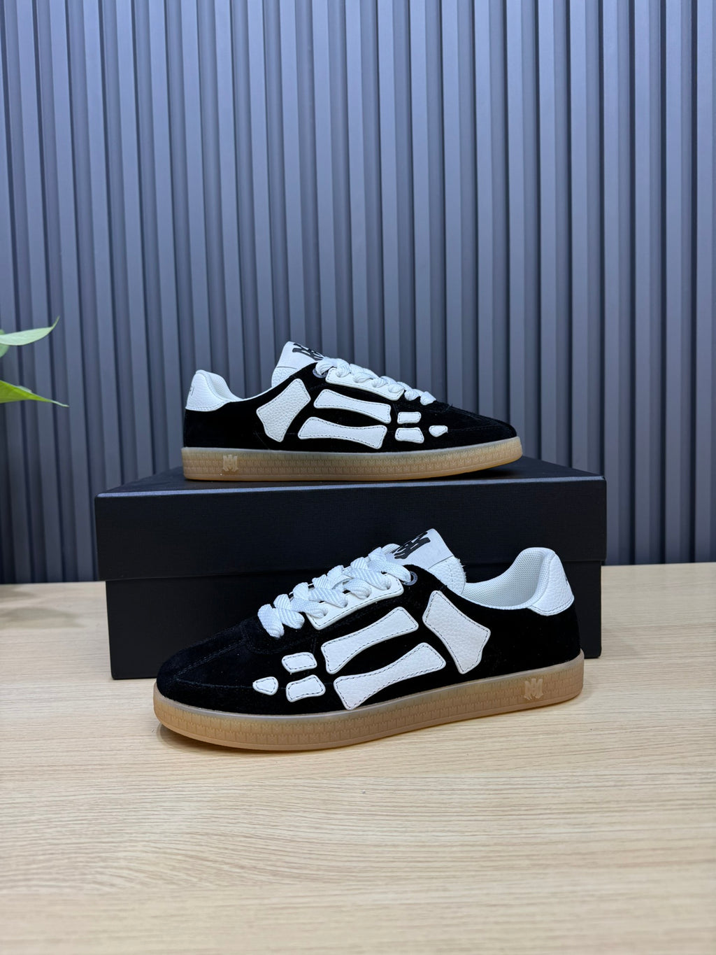 AMIRI Black Low-Top Sneakers with White Bone Details and Gum Sole