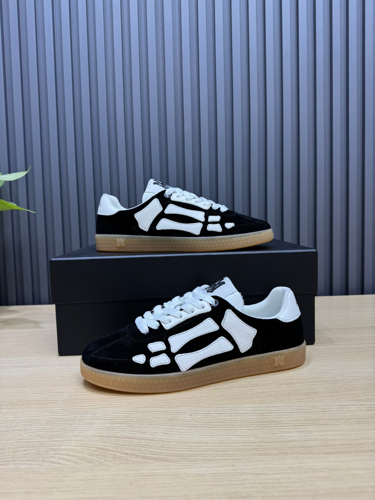AMIRI Black Low-Top Sneakers with White Bone Details and Gum Sole