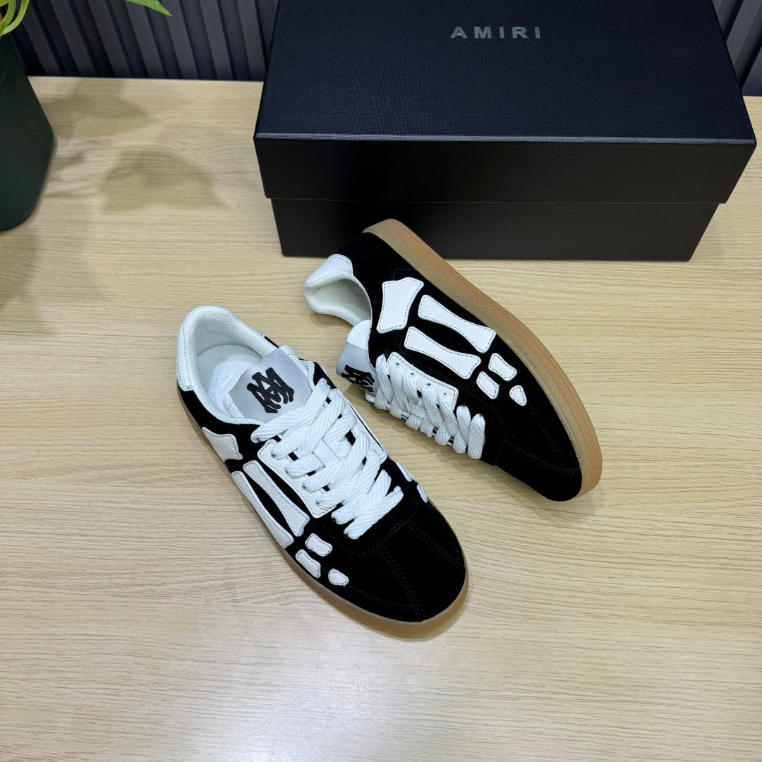 AMIRI Black Low-Top Sneakers with White Bone Details and Gum Sole