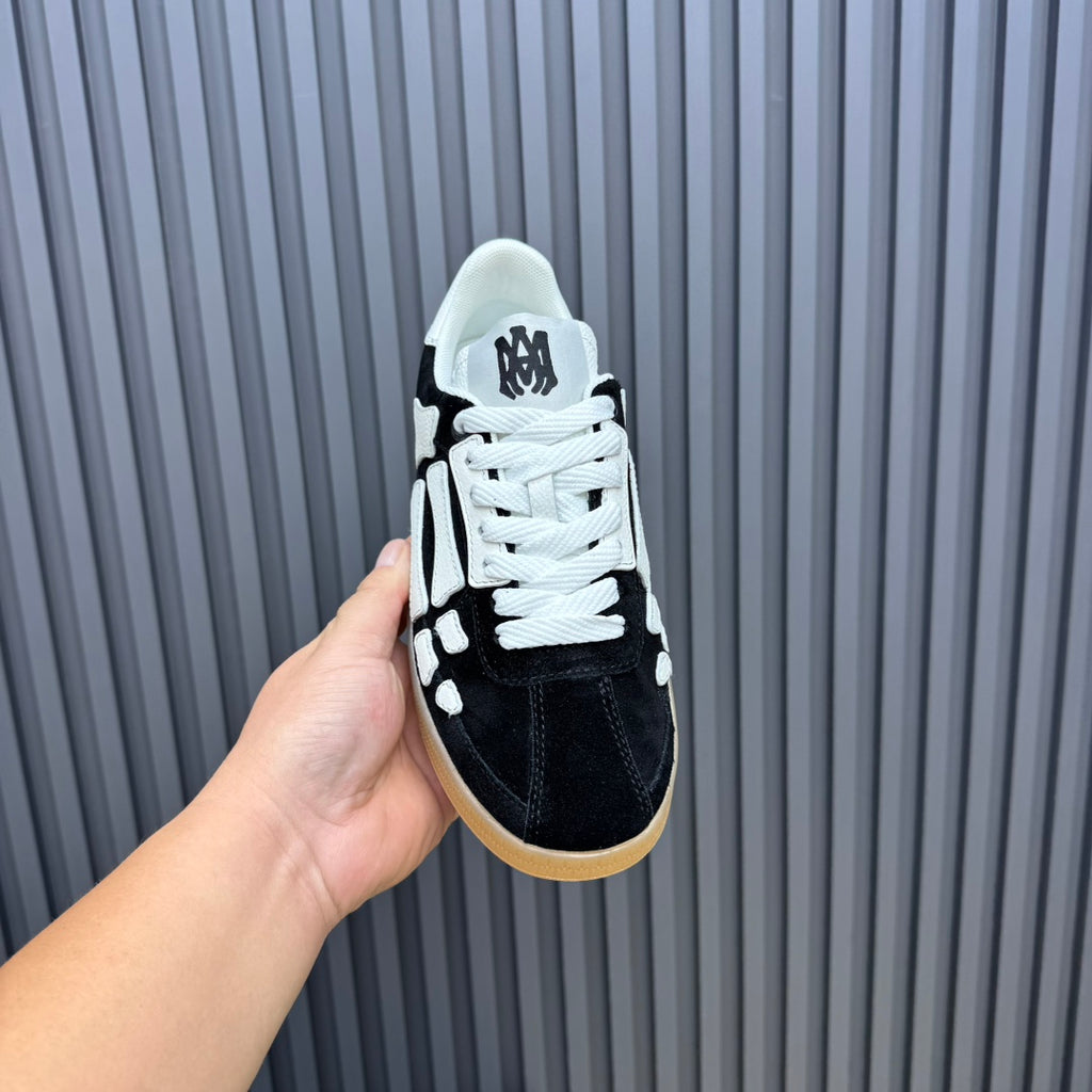 AMIRI Black Low-Top Sneakers with White Bone Details and Gum Sole